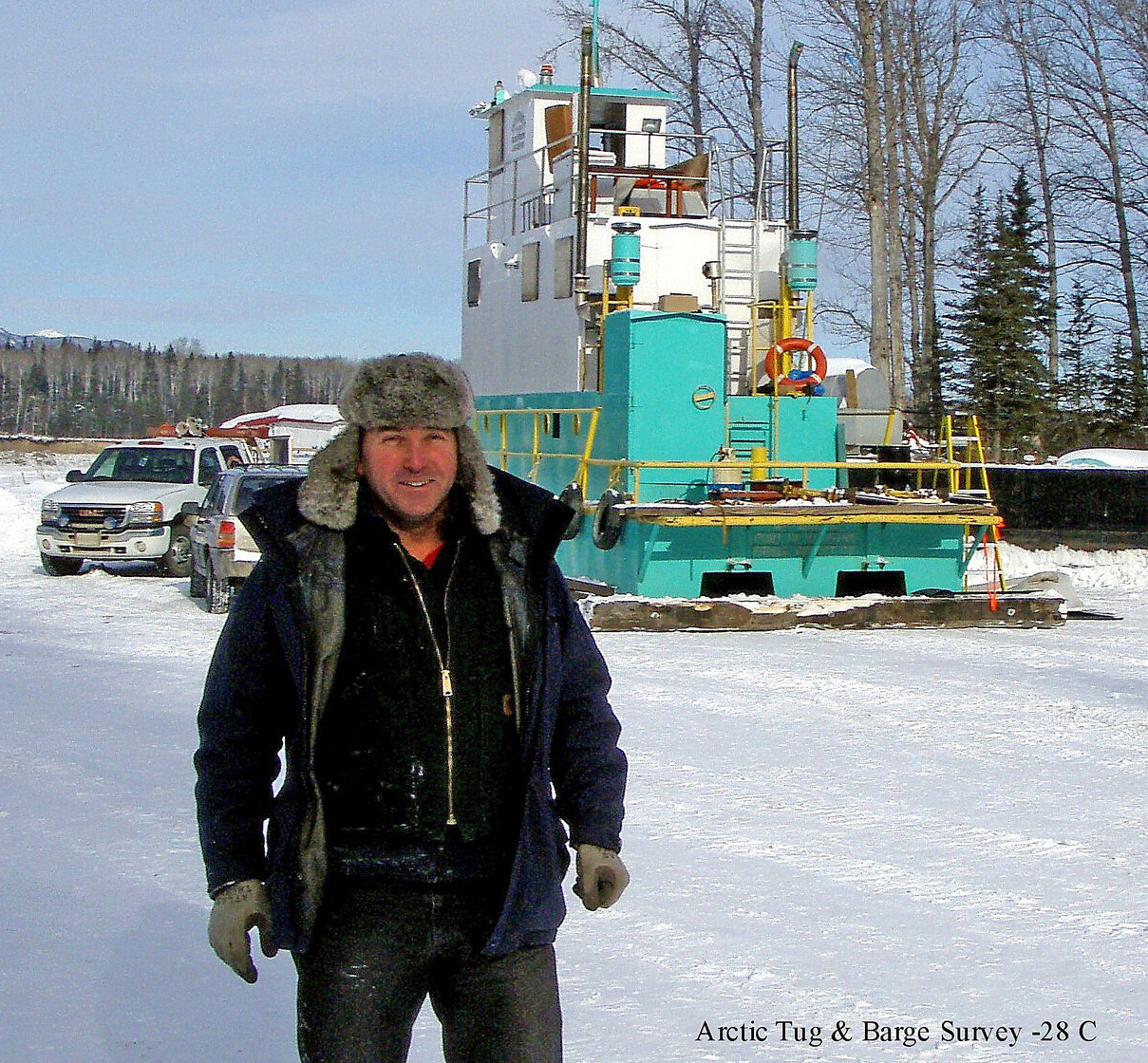 Marine surveyor on site for an arctic tug and barge survey in winter conditions